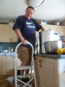 My husband stirring the tomato sauce that we eventually canned.