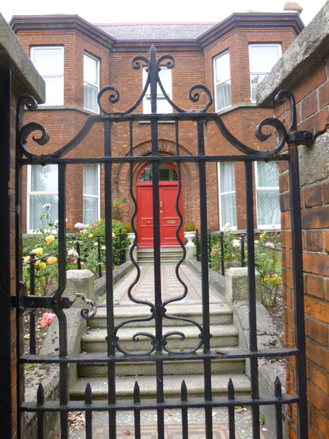 A gate framing the entrance to a home in Dublin.