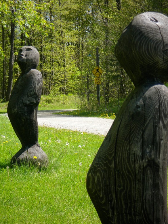 Sculptures surrounding the totem pole.